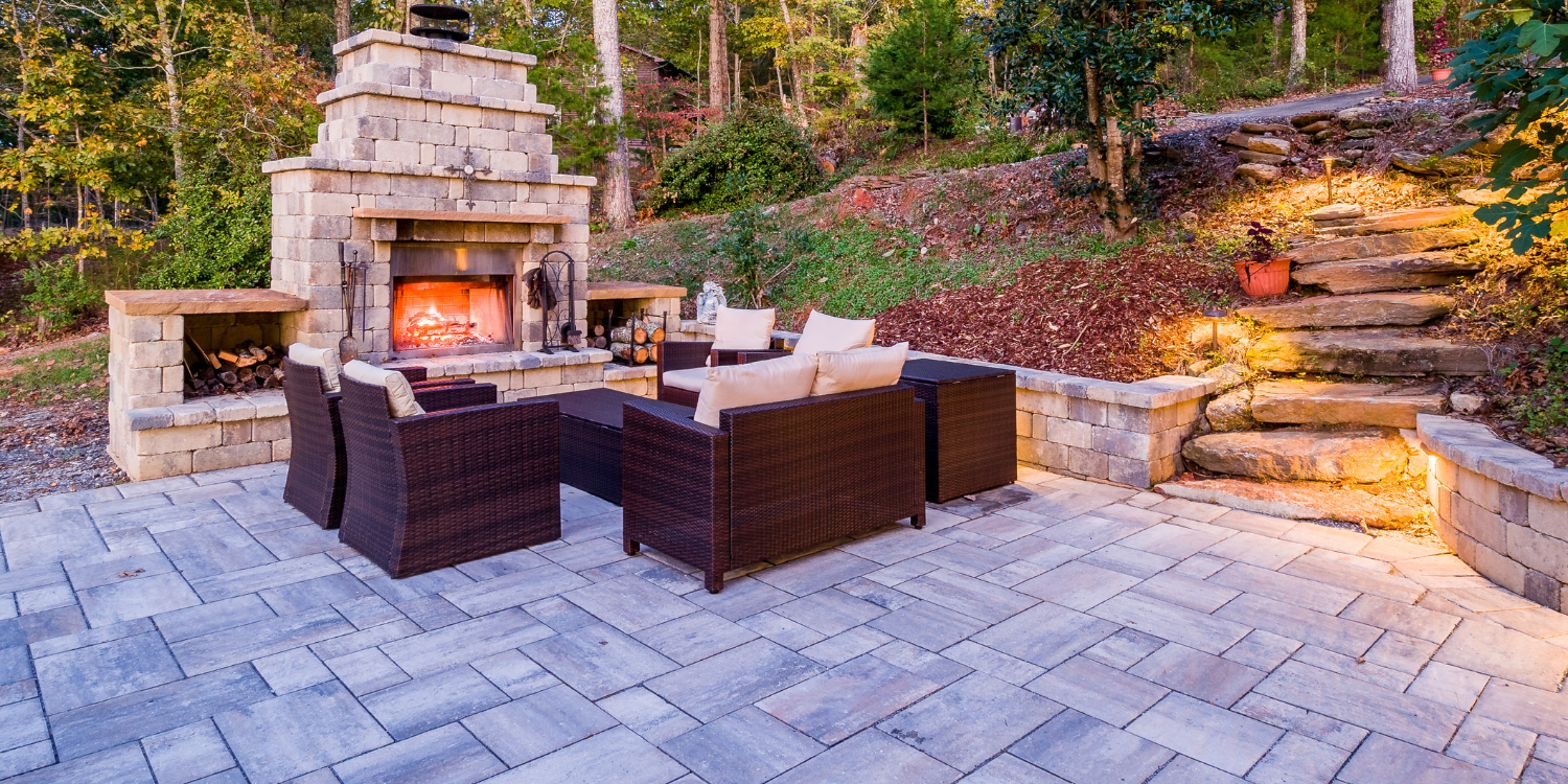 Interlocking stone patio with fireplace and furniture - 3 Eco-Friendly Reasons to Consider Interlocking Stones