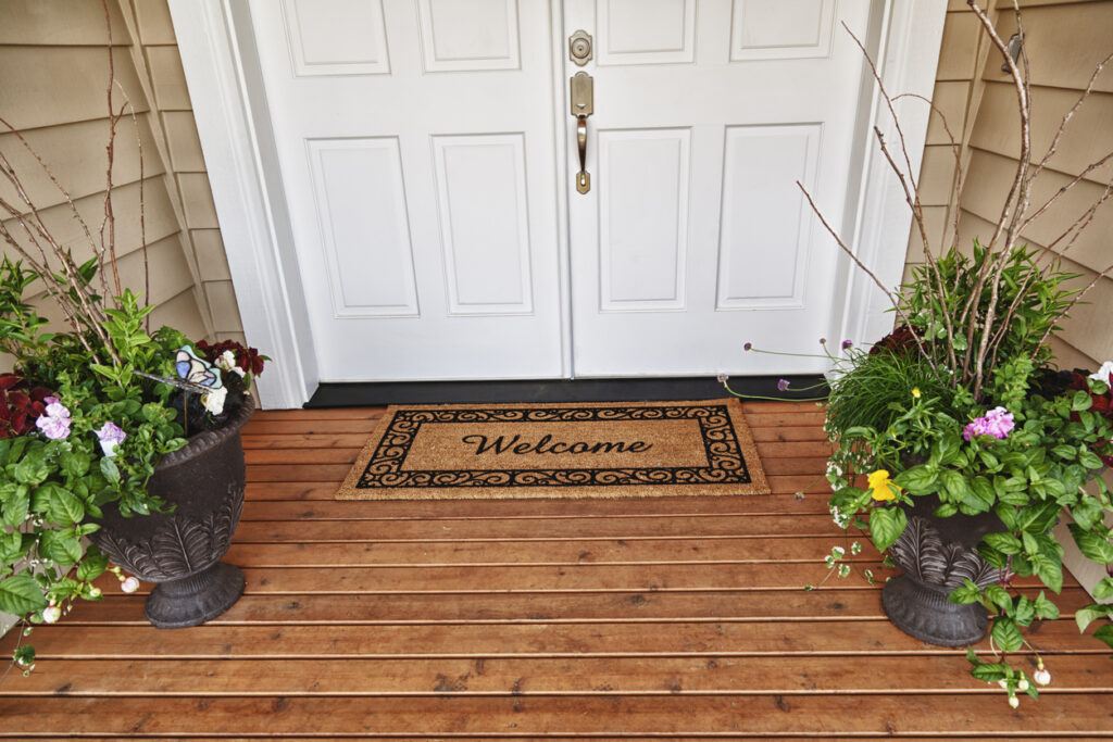 Welcome Home Entrance Double Doorway Flowers In Pots